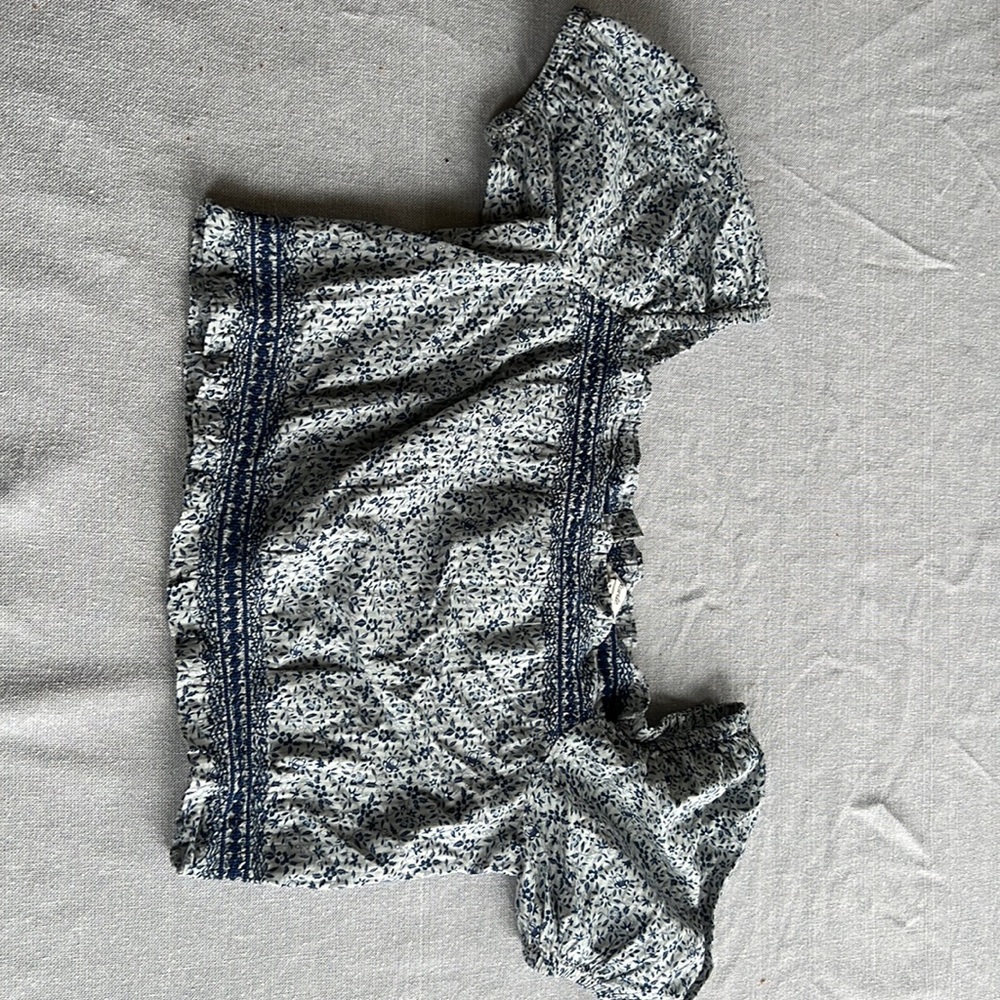 Blue and white shirt with small leaves on them.  Soft.  Cinched waist